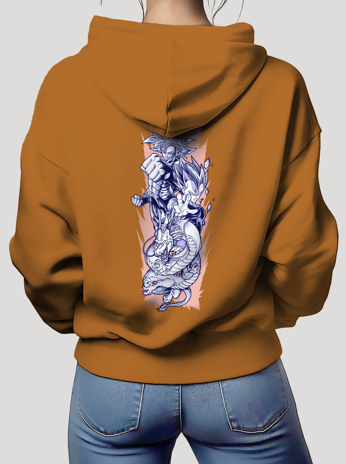Orange hoodie featuring the Goku, Vegeta and Shenron prints in blue and white on front and back, made from 100% organic breathable cotton, with an oversized fit when sized up.